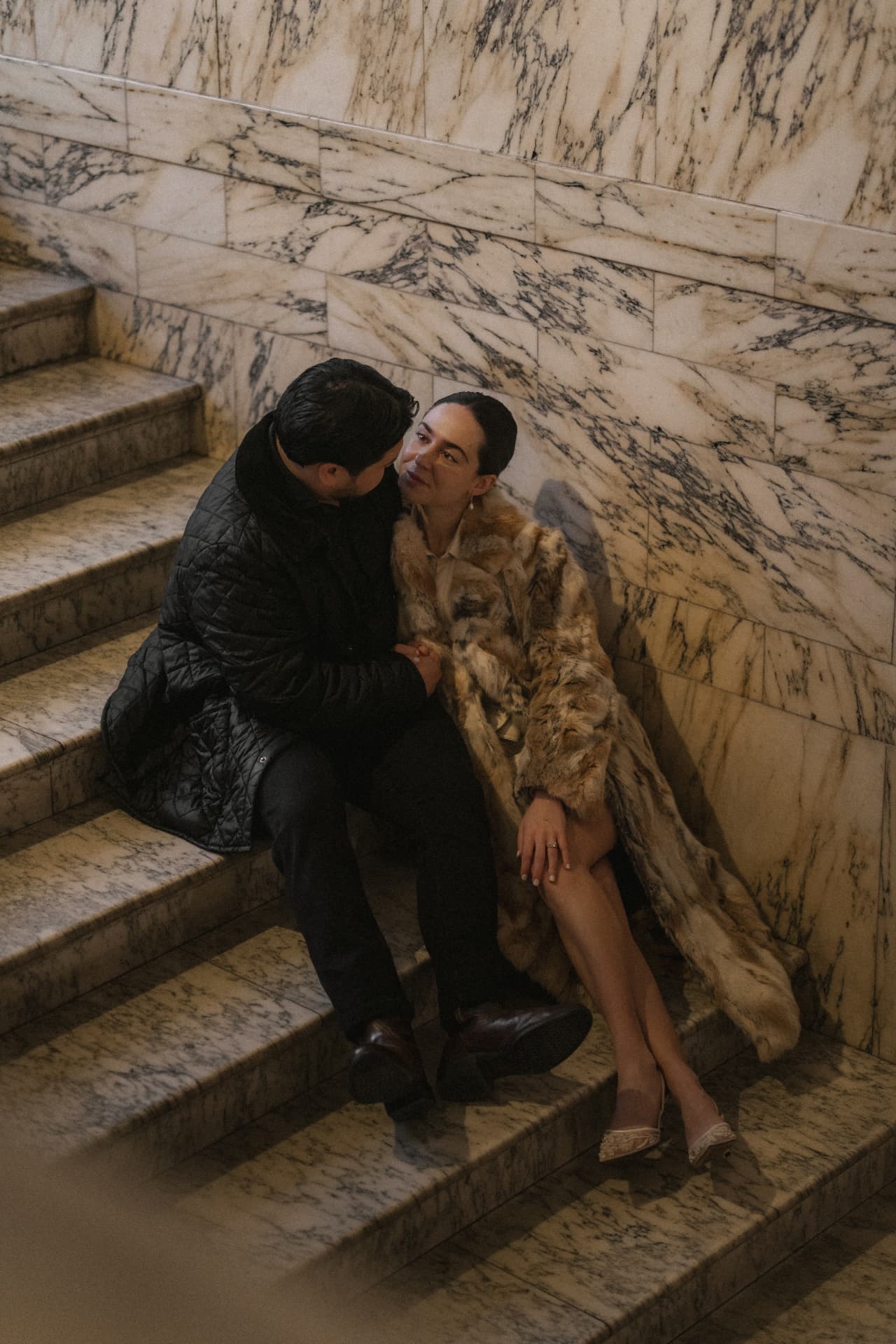 Sitting together on the marble staircase
