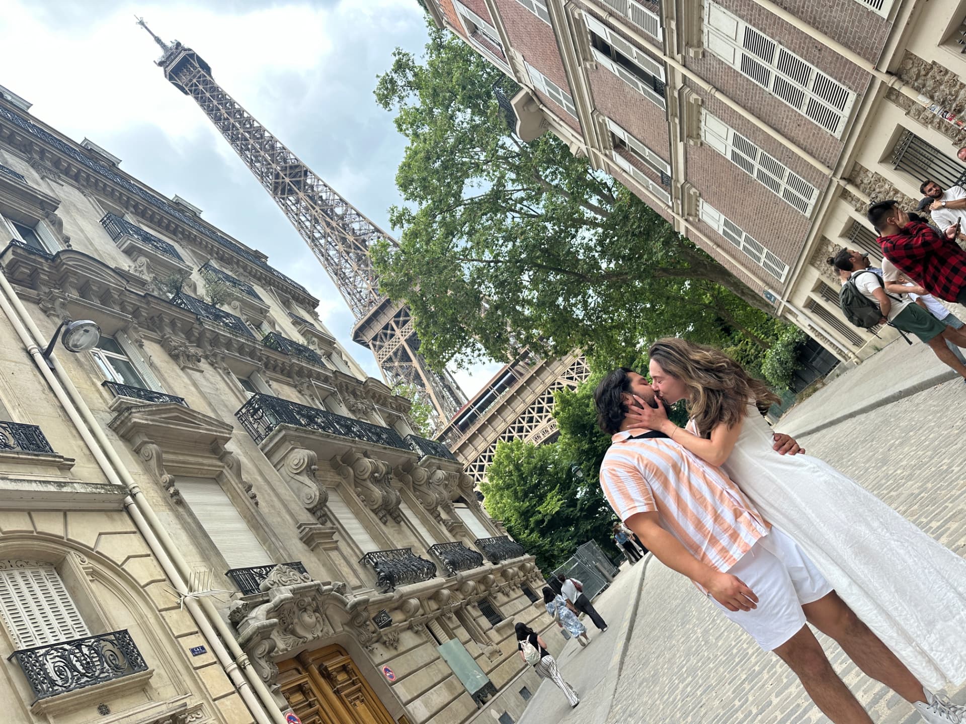 A moment together beneath the Eiffel Tower