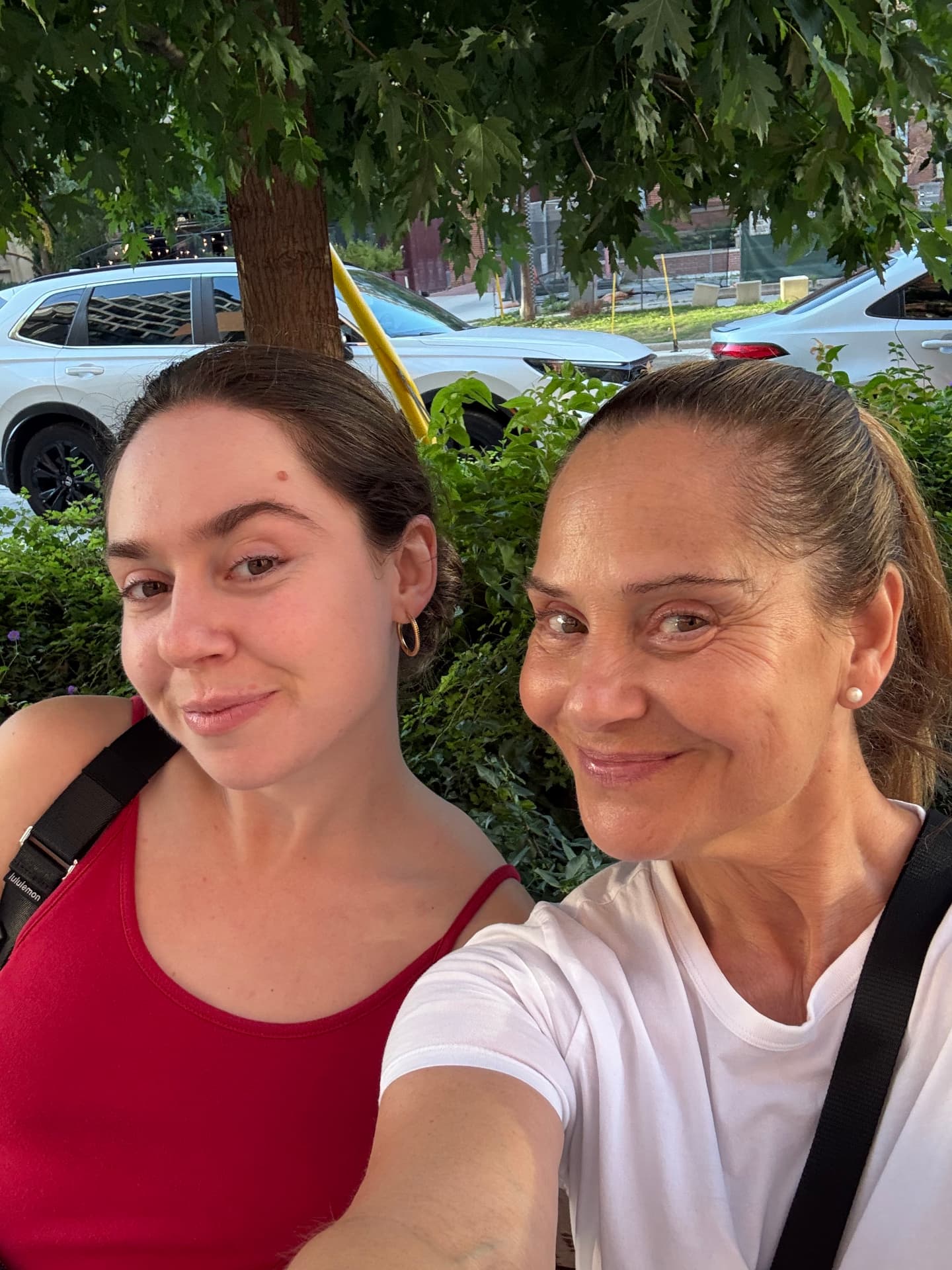 Two friends smiling together in Toronto
